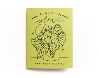 May include: A green booklet with the title "How to Keep a Plant Alive and Also Yourself" in black text. A black line drawing of a potted plant with leaves is in the center of the booklet.