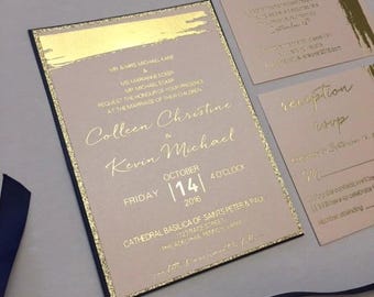 May include: Gold foil wedding invitation with a pink background and black border. The invitation reads "Colleen Christine & Kevin Michael" with the date "October 14, 2016" and the time "4 o'clock".
