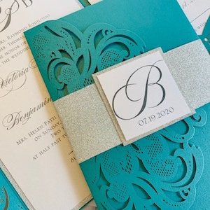 Aqua, Teal or Turquoise Laser Cut Wedding Invitation set with silver glitter in a pocket folder. Aqua Blue Laser Cut Wedding Invitation set image 1