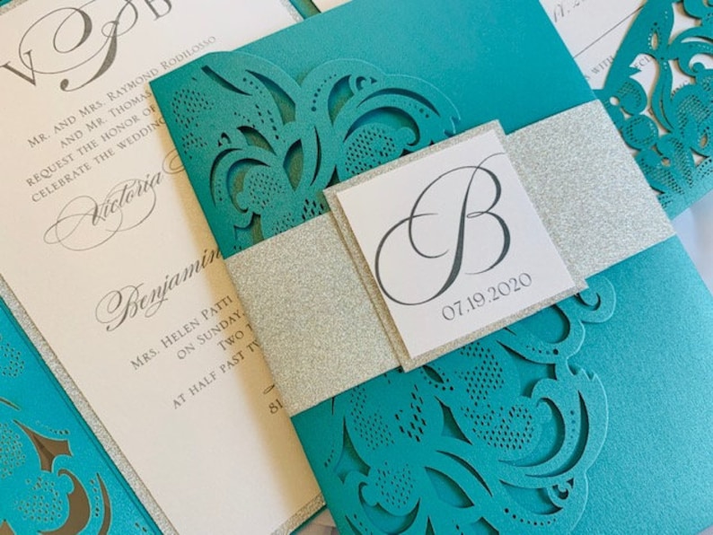 Aqua, Teal or Turquoise Laser Cut Wedding Invitation set with silver glitter in a pocket folder. Aqua Blue Laser Cut Wedding Invitation set image 1