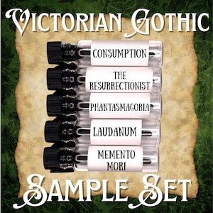 May include: A sample set of small glass vials with black caps, labeled with gothic-themed names like "Consumption" and "Memento Mori." The text "Victorian Gothic" and "Sample Set" are displayed in elegant script.