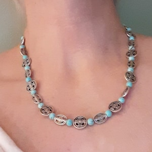 Turquoise and antique silver necklace, ant silver discs with round turquoise beads sprinkled about. Magnetic clasp
