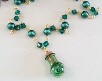 Emerald Green Necklace with green Swarovski crystals and pearls with green ampule filled with green crystals