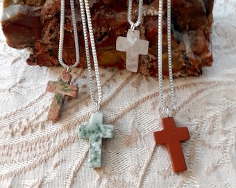 Cross pendants hung from sterling silver chain with lobster claw clasp