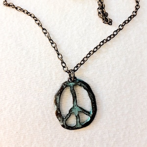 Peace, love and happiness pendant on an antique  bronze linked chain with toggle clasp