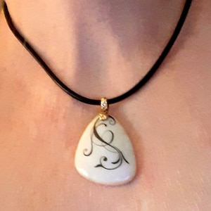 Casual elegance choker,  white stone pendant with black stenciling on black leather cord