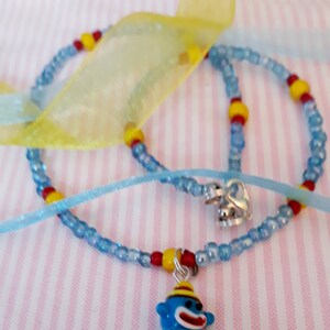 Sock monkey pendant necklace on a strand of glass seed beads image 7