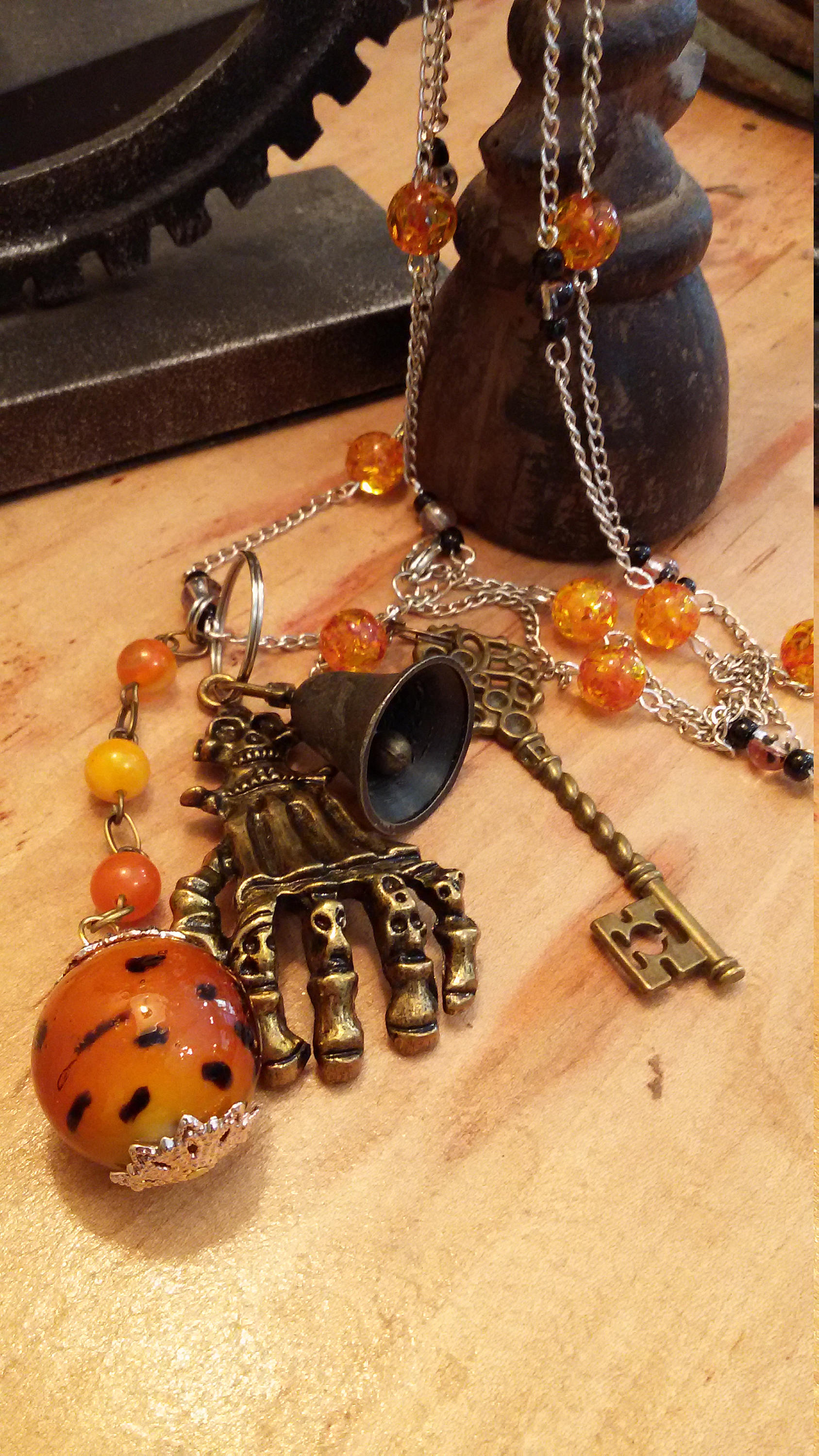 Gothic necklace, skeleton hand, orange pumpkin bead, old key and bell