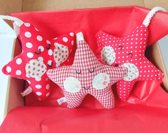 Set of three small red handmade fabric stars perfect for hanging on your Christmas tree and decorating your home this holiday. Gift for Xmas