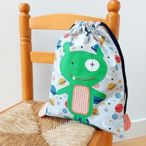 Sac monstre galactique en tissu. Sac enfant polyvalent pour la maternelle et l'école. Idéal pour emporter des vêtements de rechange et une collation.