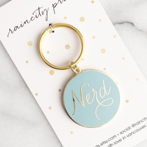 Nerd Enamel Keychain. Gold Nerd Keychain. Nerd Keyring. Nerd Enamel Pin. Nerd Accessory