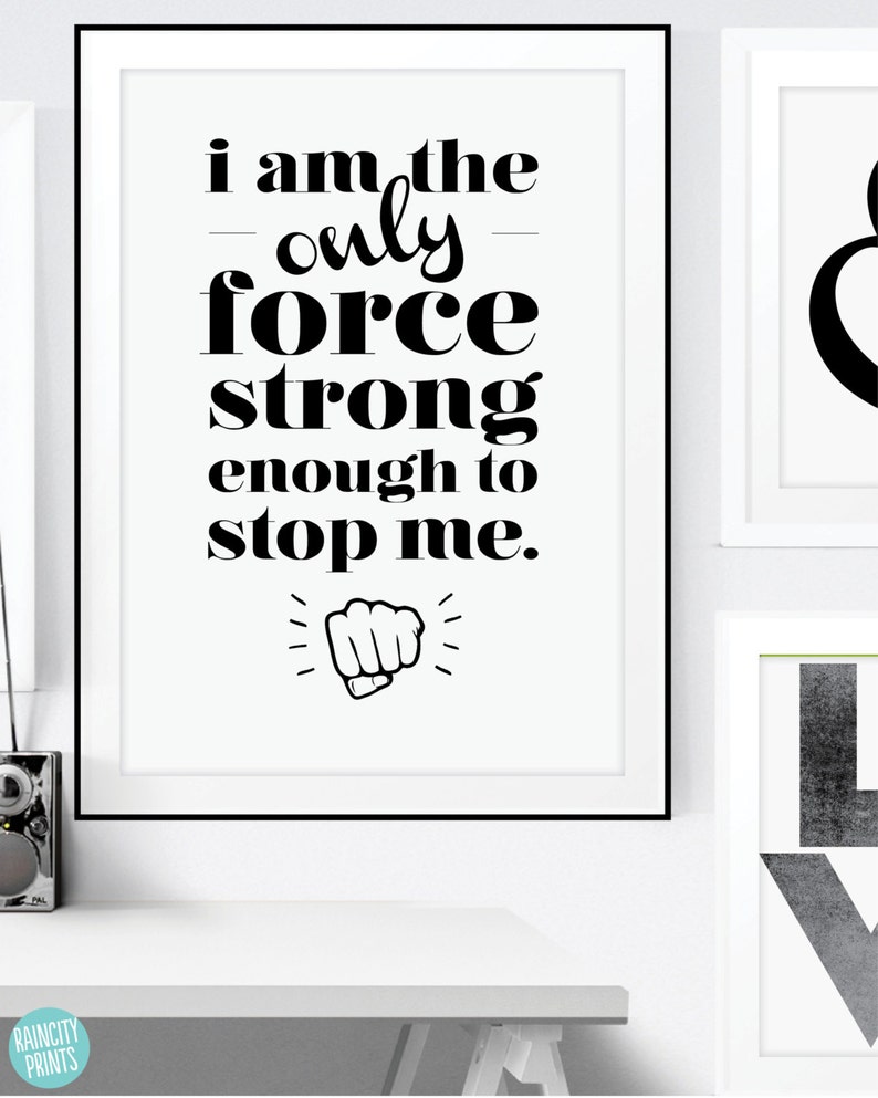 May include: Black and white motivational quote print with the text "I am the only force strong enough to stop me." and a black fist graphic.