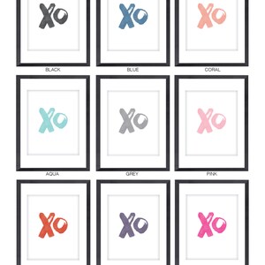 May include: Nine framed prints of the letters XO in different colors: black, blue, coral, aqua, grey, pink, red, purple, and hot pink.