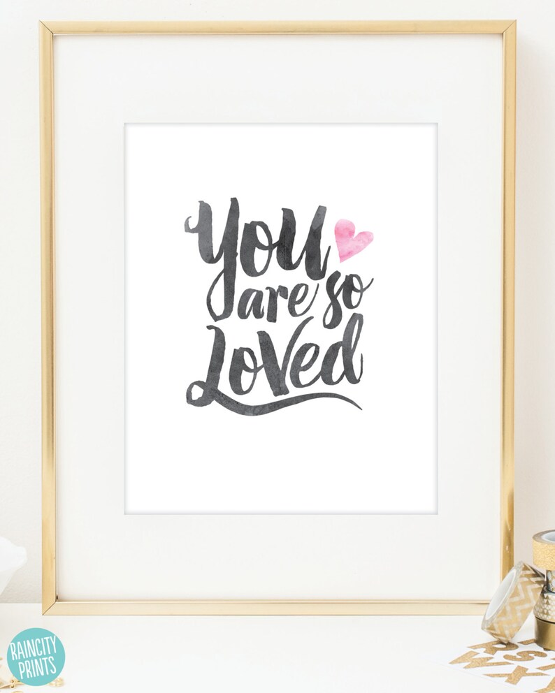 May include: A white framed print with the text "You are so Loved" in black script with a pink heart. The print is on a white background.