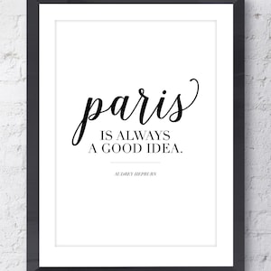 May include: Black and white printable quote art featuring the text "paris is always a good idea." with the name Audrey Hepburn below the quote.