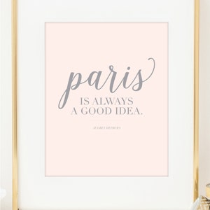 May include: A pink printable quote with the text "paris is always a good idea."  The quote is attributed to Audrey Hepburn.