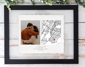 May include: A framed print featuring a couple's photo and a map of New York City with a heart marking a location. The print includes the word "Engaged" and the names "Future Mr. & Mrs. O'Brien" with a date.