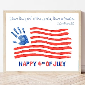 May include: A framed print with a patriotic theme. The artwork features a red and white American flag design with a blue handprint in the upper left corner. The text "HAPPY 4TH OF JULY" is displayed at the bottom.