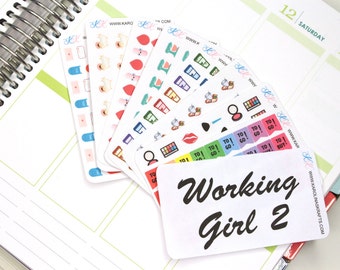 May include: A set of colorful stickers with various designs, including makeup, lipstick, and the words "To Go!" and "To Buy!" The stickers are arranged on a white surface with a white card that says "Working Girl 2" in black cursive writing.