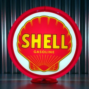 May include: A red and white gas station globe sign with a yellow shell and the word "SHELL" in yellow letters. The globe also has the word "GASOLINE" in yellow letters.