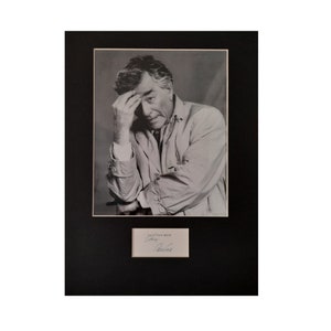 May include: Black and white photo of a man in a jacket, with his hand on his forehead. The photo is signed "Best wishes" and "Peter O'Toole".