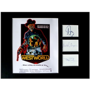 May include: A vintage movie poster for the film "Westworld" featuring a cowboy with a gun and the tagline "Where nothing can possibly go wrong!" The poster is signed by Yul Brynner, Richard Benjamin, and James Brolin.
