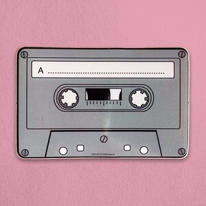 May include: A silver cassette tape with the letter A and a black tape counter. The tape is labeled "PS4637C © 2004 Pyramid".