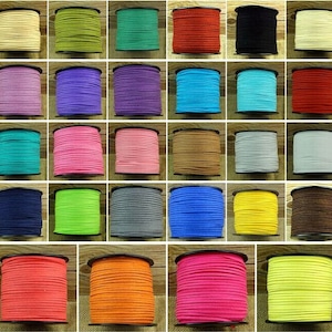 May include: Assortment of 20 spools of suede cord in various colors, including beige, green, teal, red, black, purple, blue, pink, brown, gray, yellow, and orange. Each spool is wound with a different color cord.
