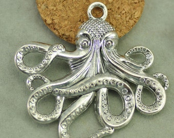 May include: Silver-toned octopus charm with detailed tentacles and a textured body. The charm has a loop at the top for attaching to jewelry or other crafts.