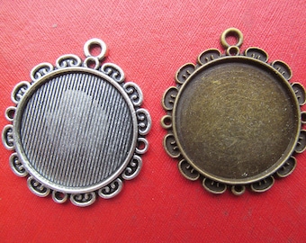 May include: Two silver and bronze pendant trays with scalloped edges. The trays are round and have a smooth, shiny finish. They are perfect for adding a touch of elegance to your jewelry making projects.