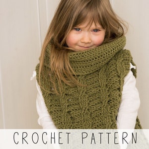girl in green cable vest with hidden pocket and oversized collar, crochet pattern to make kids poncho