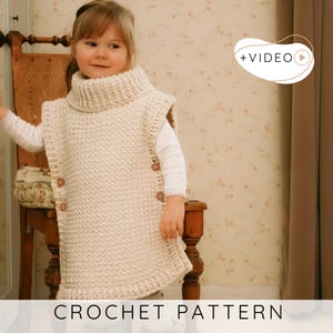 May include: A cream-colored, crocheted poncho with a turtleneck collar and wooden buttons. The poncho is worn by a young child. The text "CROCHET PATTERN" is displayed at the bottom of the image.
