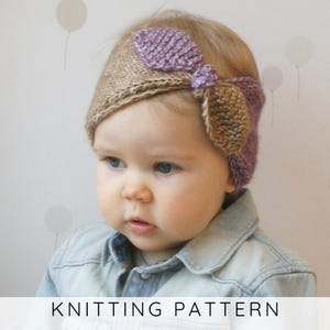 May include: A knitted headband featuring a two-tone design with a tan base and a purple bow detail on the side. The accessory is crafted with a textured knit stitch pattern. The text KNITTING PATTERN is displayed at the bottom of the image.