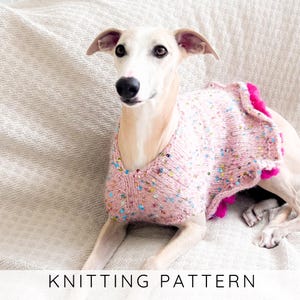 May include: A light pink knitted dog sweater featuring scattered multicolored sequins and a bright pink ruffled trim along the back edge. The garment is worn by a light-colored dog. The text KNITTING PATTERN is displayed at the bottom.
