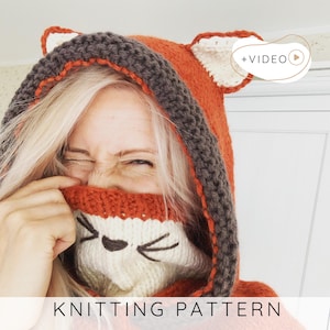 May include: A knitted fox hood in orange, brown, and white, with fox ear details. The hood covers the head and neck, with a face design on the front. The text "KNITTING PATTERN" is at the bottom.