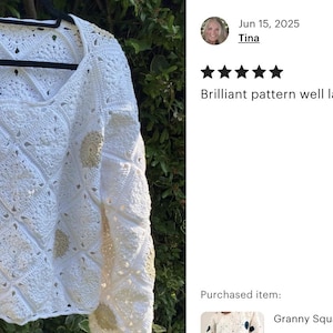 May include: White crochet sweater with a V-neck and long sleeves, featuring a square pattern with gold accents. The sweater is displayed on a black hanger. Text on the right says "Brilliant pattern well laid out".
