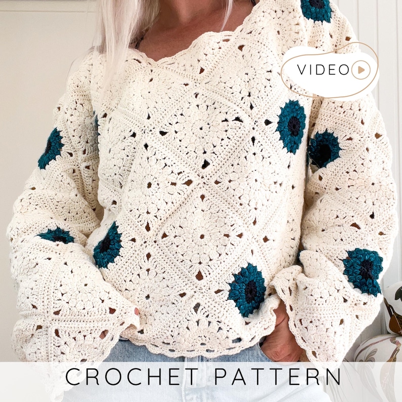 May include: Cream-colored crochet sweater with a V-neck and long sleeves, featuring dark teal floral accents. The sweater has a detailed openwork pattern and the words "CROCHET PATTERN" are displayed at the bottom.