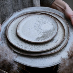 STC classic natural shape stoneware plates bowls in grey cream, minimalist monochrome handcrafted handmade pottery matte