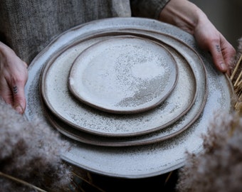 STC classic natural shape stoneware plates bowls in grey cream, minimalist monochrome handcrafted handmade pottery matte