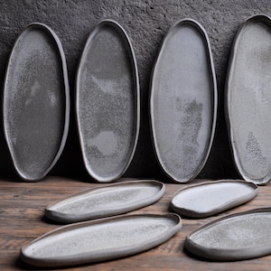 Organic natural shape elongated stoneware plates in grey cream, minimalist monochrome handcrafted handmade  pottery DUNE
