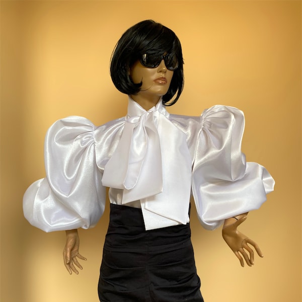 White formal satin blouse with puffy sleeves and large bow