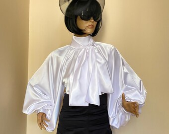 Formal white satin blouse with high neck, puffy sleeves and bow tie