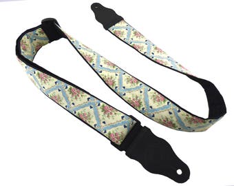 Square guitar strap with flowers.  Pink flower buds, black leather ends for electric, acoustic, bass guitars. Shades of light blue & white