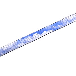 May include: A blue and white camera strap with the text "Success is falling nine times, getting up ten. Success is an attitude. Neither enthusiasm nor happiness comes into your life, you go to get it. Success is going from failure to failure with no loss of enthusiasm. One small positive thought can change everything." printed on it.