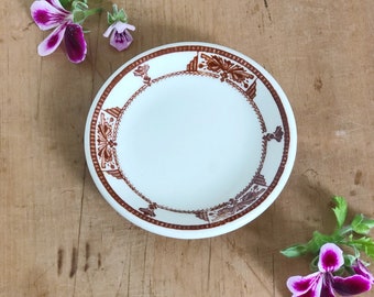 Brown and White Ironstone Butter Pat