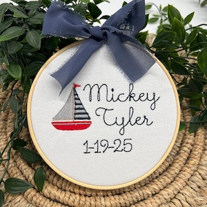 Nursery Name Sign Birth Announcement Sailboat Design Nautical Theme Baby Boy Room Decoration Wall Art Personalized Hoop Embroidered Gift Baby Shower Present Newborn Keepsake Custom Display Maritime Decor Blue White Colors Handmade Creation