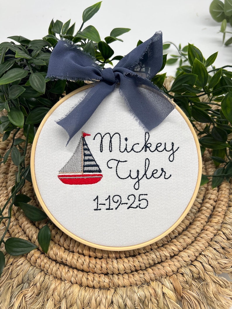 Nursery Name Sign Birth Announcement Sailboat Design Nautical Theme Baby Boy Room Decoration Wall Art Personalized Hoop Embroidered Gift Baby Shower Present Newborn Keepsake Custom Display Maritime Decor Blue White Colors Handmade Creation
