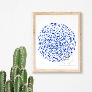 May include: A framed print with a blue watercolor design of a circle made up of small blue dots. The print has the text "HIPPIHOPPY.COM" at the bottom.