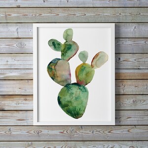 May include: Watercolor painting of a green cactus plant with a white background. The cactus is painted in shades of green, brown, and yellow.