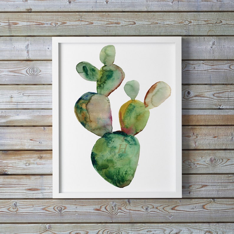 May include: Watercolor painting of a green cactus plant with a white background. The cactus is painted in shades of green, brown, and yellow.